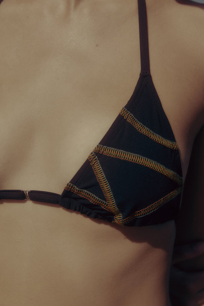 Triangle top with contrast multi-stitch detail by Luka Rey.