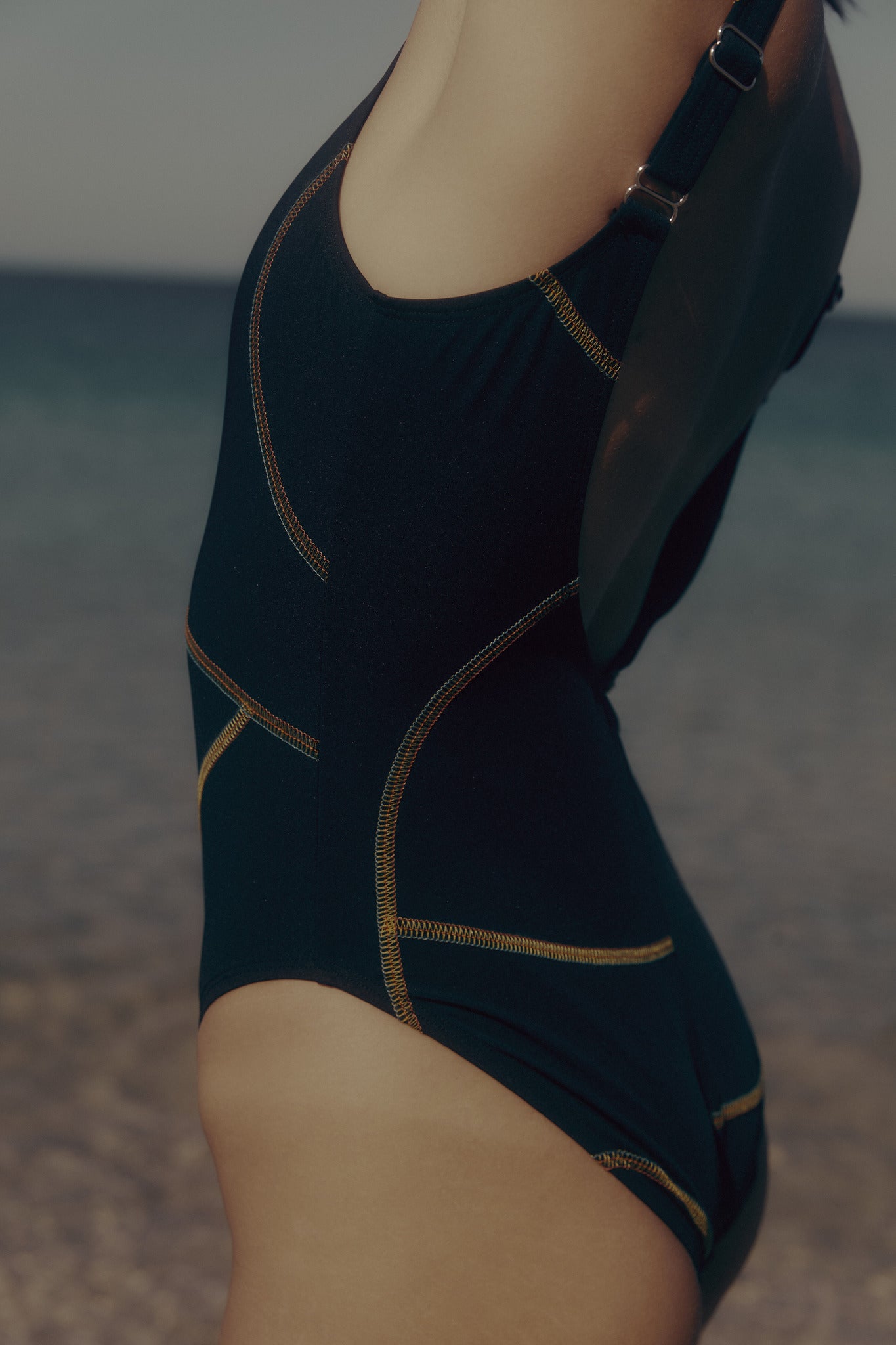 Black one-piece swimsuit with contrast multi stitch detail by Luka Rey. 